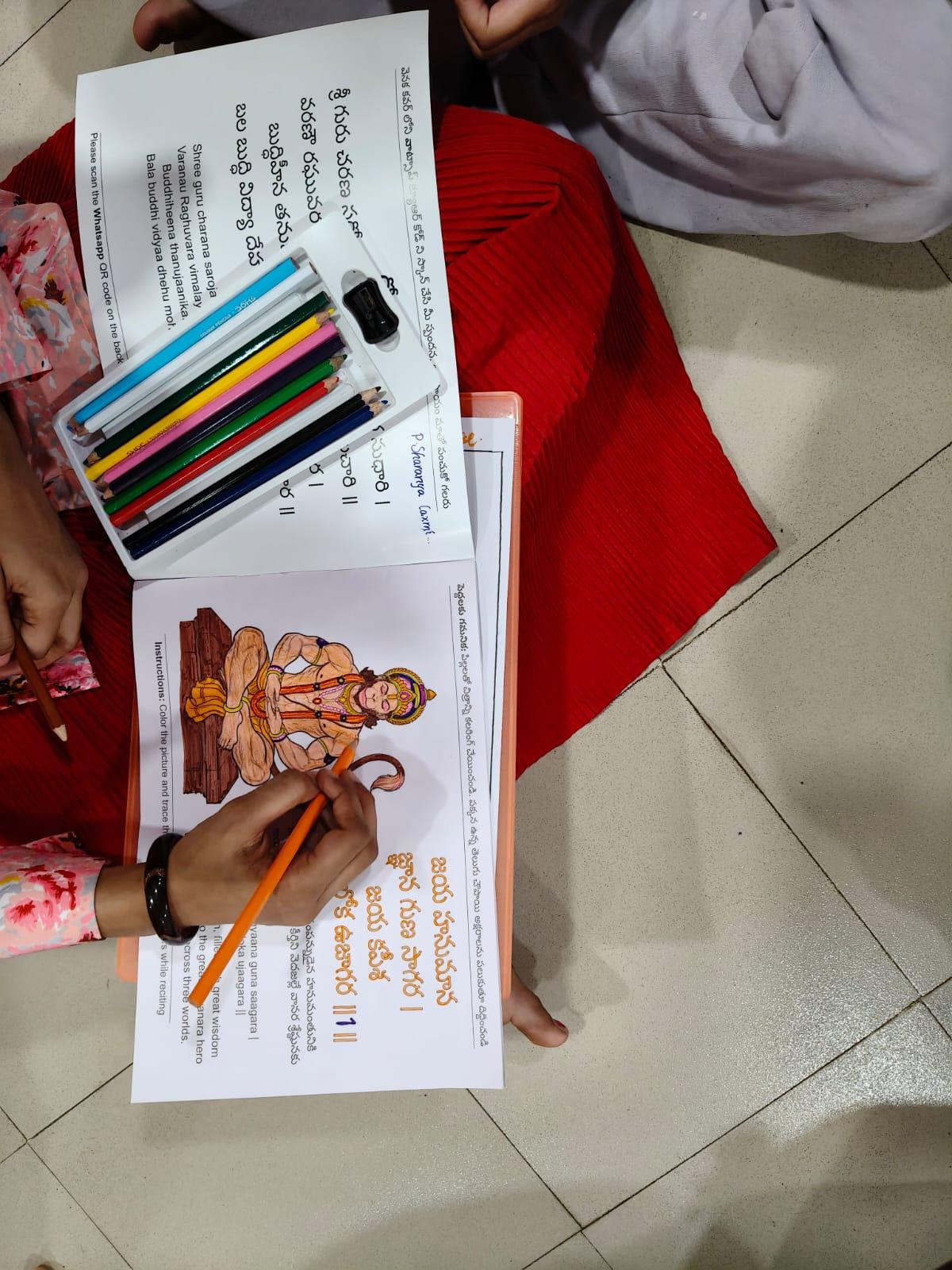 Child coloring and tracing the Hanuman Chalisa — #24